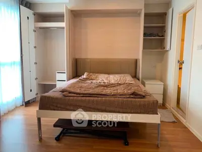 Modern bedroom with Murphy bed and built-in storage, perfect for maximizing space in urban living.