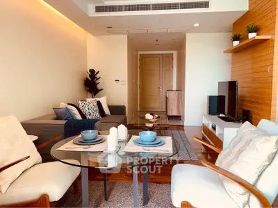 Modern living room with stylish decor and cozy seating area, perfect for relaxation and entertainment.
