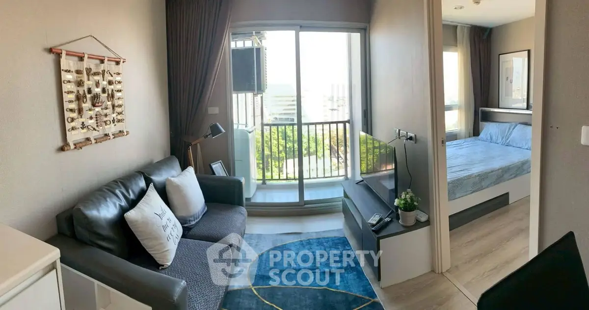 Modern apartment living room with balcony and bedroom view, featuring stylish decor and natural light.