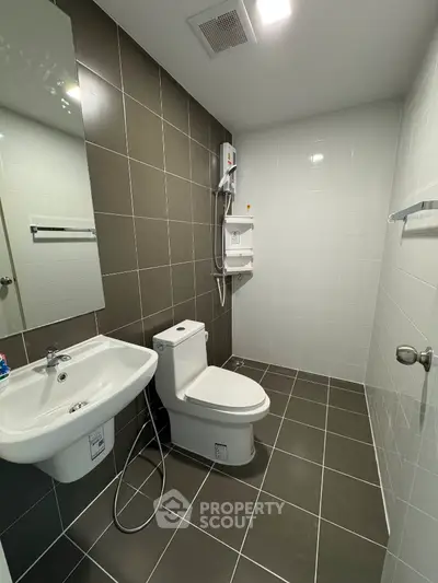 Modern bathroom with sleek tiles and contemporary fixtures