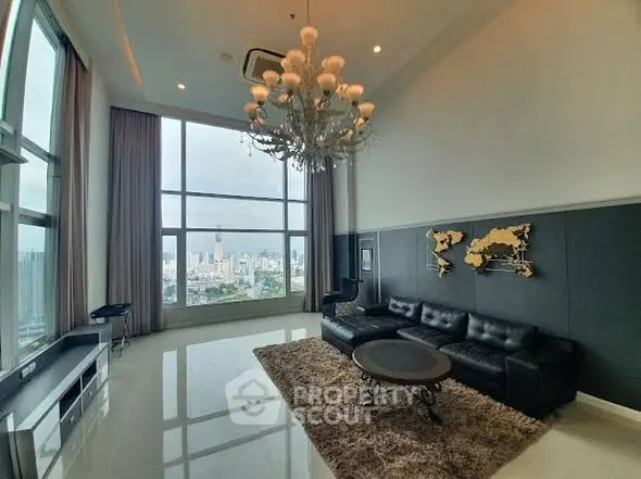 Luxurious high-rise living room with stunning city view and elegant chandelier.