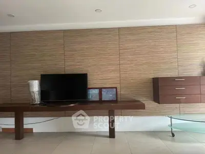 Modern living room with sleek wooden paneling and contemporary decor