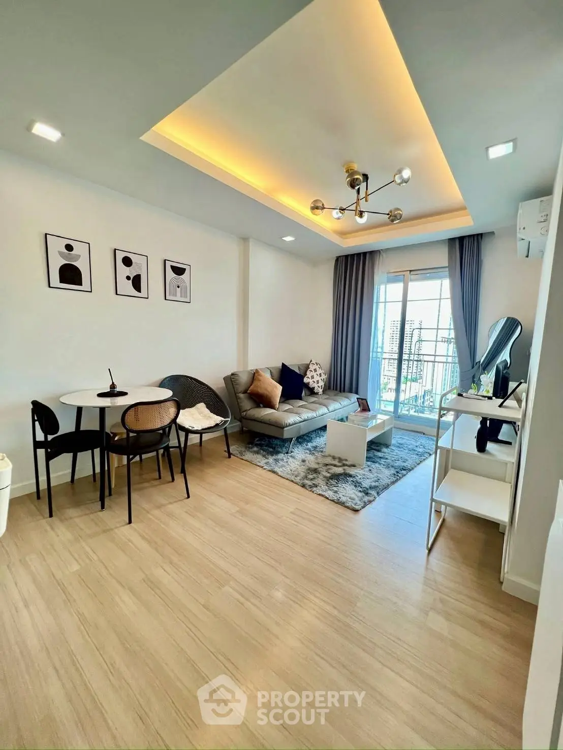 Modern living room with stylish decor and balcony view