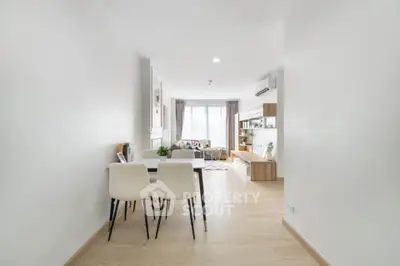 Spacious modern living room with elegant dining area and natural light