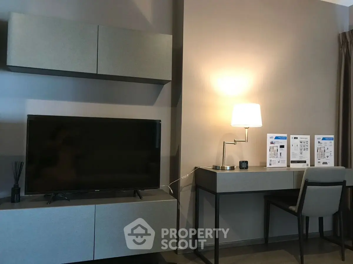 Modern living room with sleek TV unit and stylish desk setup