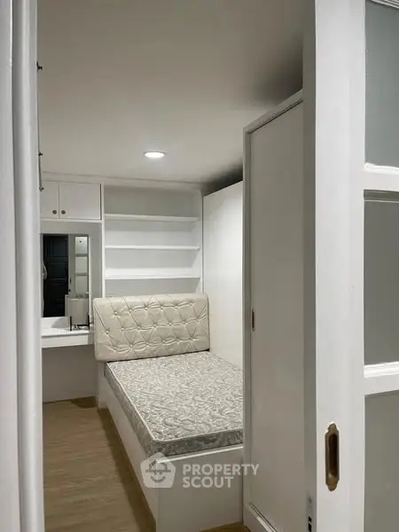 Cozy small bedroom with built-in storage and minimalist design