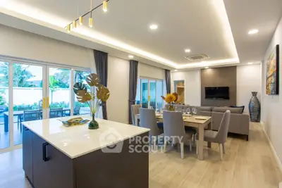 Luxurious open-plan living room with modern dining area and stylish decor