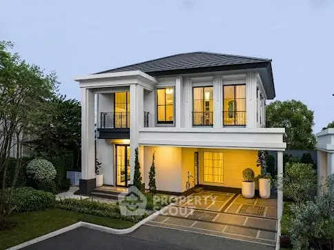 Elegant two-story house with modern architecture and lush landscaping