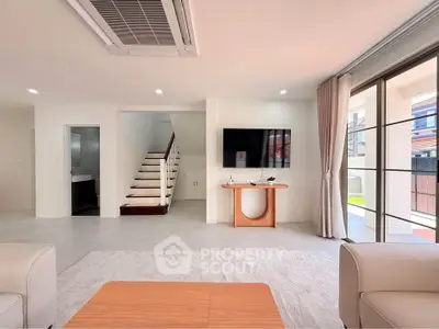 Spacious modern living room with sleek design and natural light