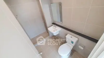 Modern bathroom with sleek tiles and compact design