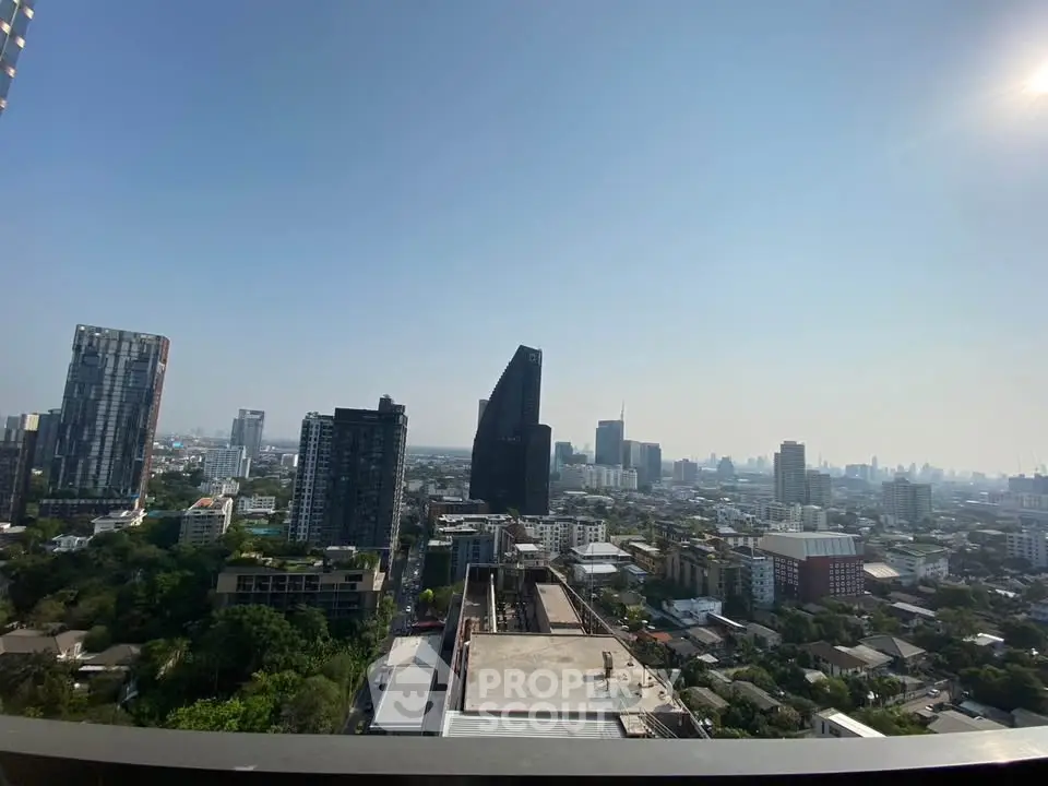 Stunning cityscape view from high-rise balcony showcasing urban skyline.