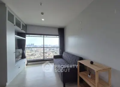 Modern living room with city view and sleek furniture