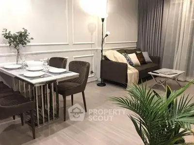 Stylish modern living room with elegant dining area and cozy sofa, perfect for urban living.