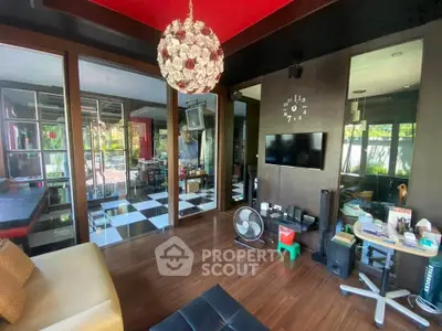 Stylish living room with modern decor and large windows for natural light.