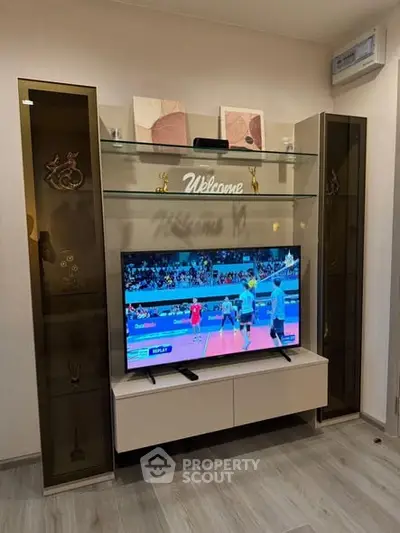 Modern living room with stylish TV unit and decorative shelves