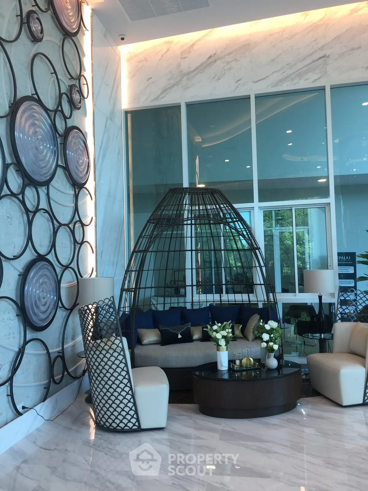 Luxurious modern lobby with stylish seating and artistic wall decor