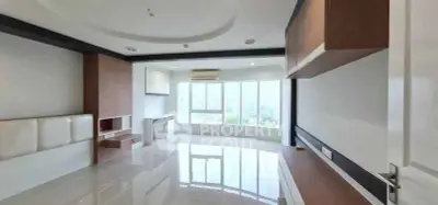 Spacious modern living room with large windows and sleek design