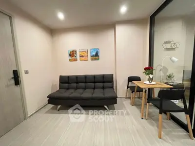 Modern living room with sleek black sofa and stylish decor