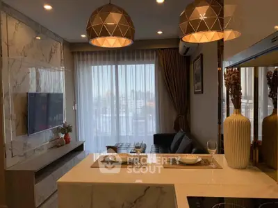 Modern living room with elegant lighting and marble accents, featuring a cozy seating area and large window view.