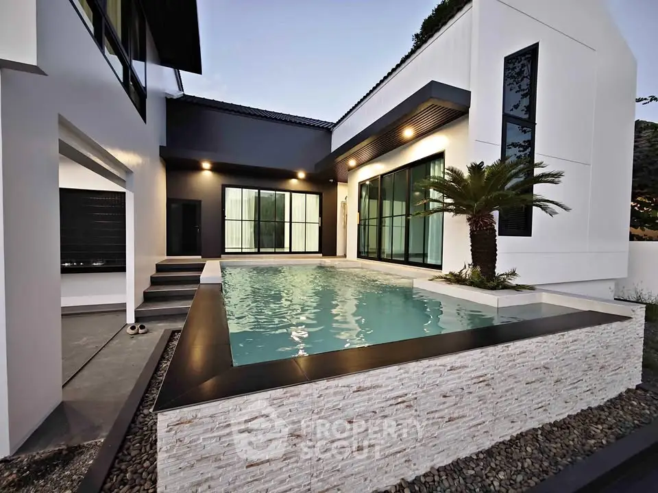 Luxurious modern home with sleek pool and elegant architecture, perfect for upscale living.