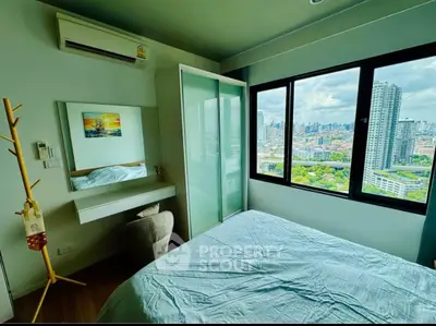 Modern bedroom with city view, large windows, and stylish decor in high-rise apartment.
