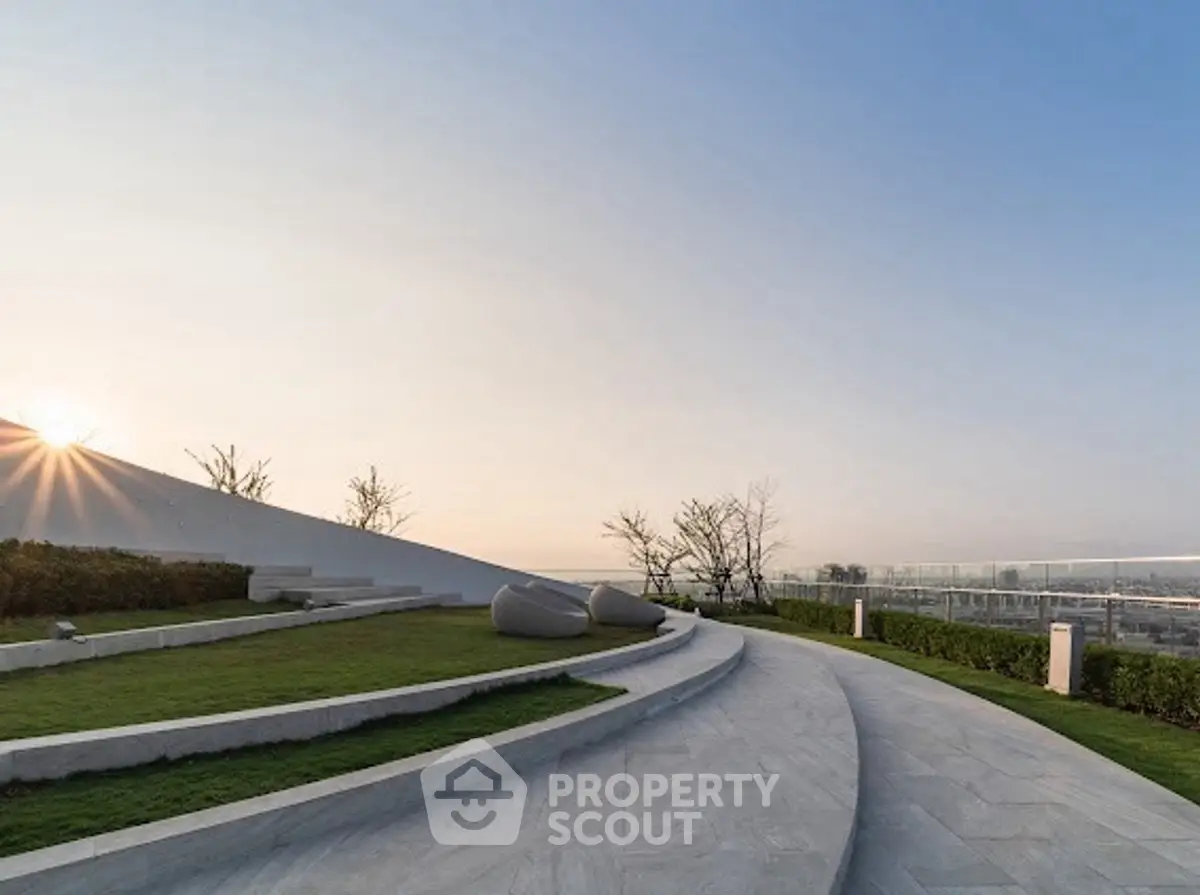 Stunning rooftop garden with modern design and panoramic views at sunset.