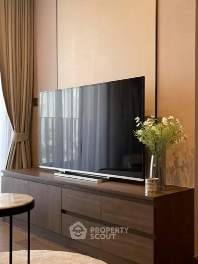 Elegant living room with modern TV setup and stylish decor
