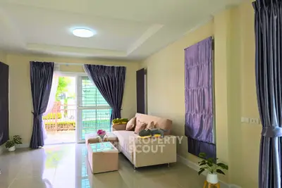 Spacious living room with modern decor and natural light
