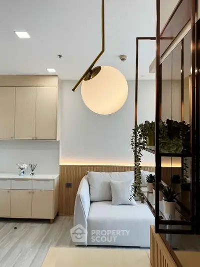 Modern living room with stylish lighting and cozy sofa in a contemporary apartment.