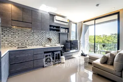 Modern open-layout living room with kitchen and balcony view
