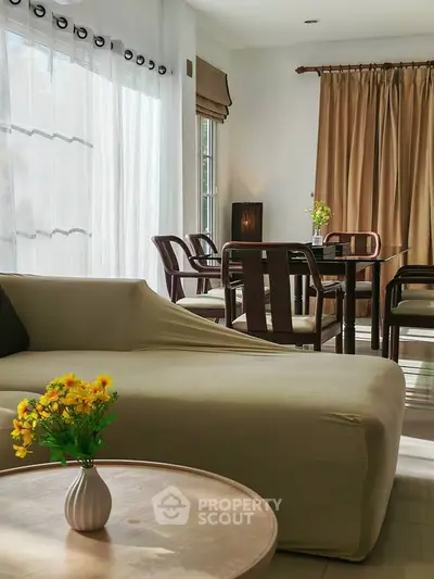 Elegant living room with stylish furniture and natural light, perfect for modern living.