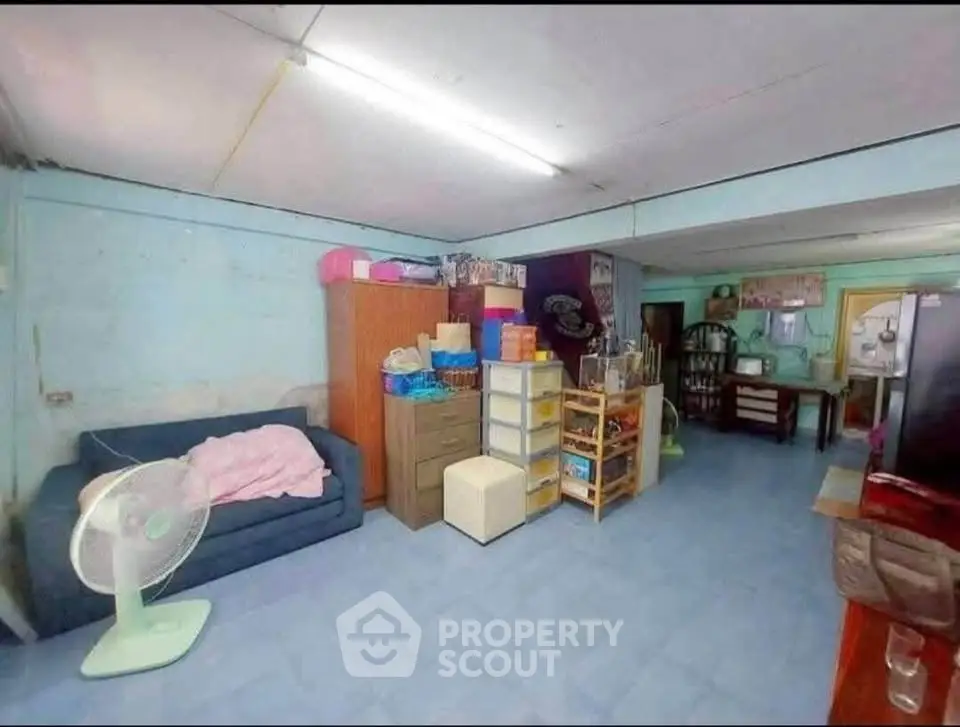 Spacious living area with cozy furniture and ample storage solutions