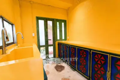 Vibrant kitchen with colorful cabinets and unique design