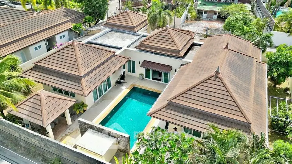 Luxurious villa with private pool and lush garden in tropical setting