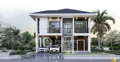 Modern two-story house with sleek design and double garage in lush green setting.