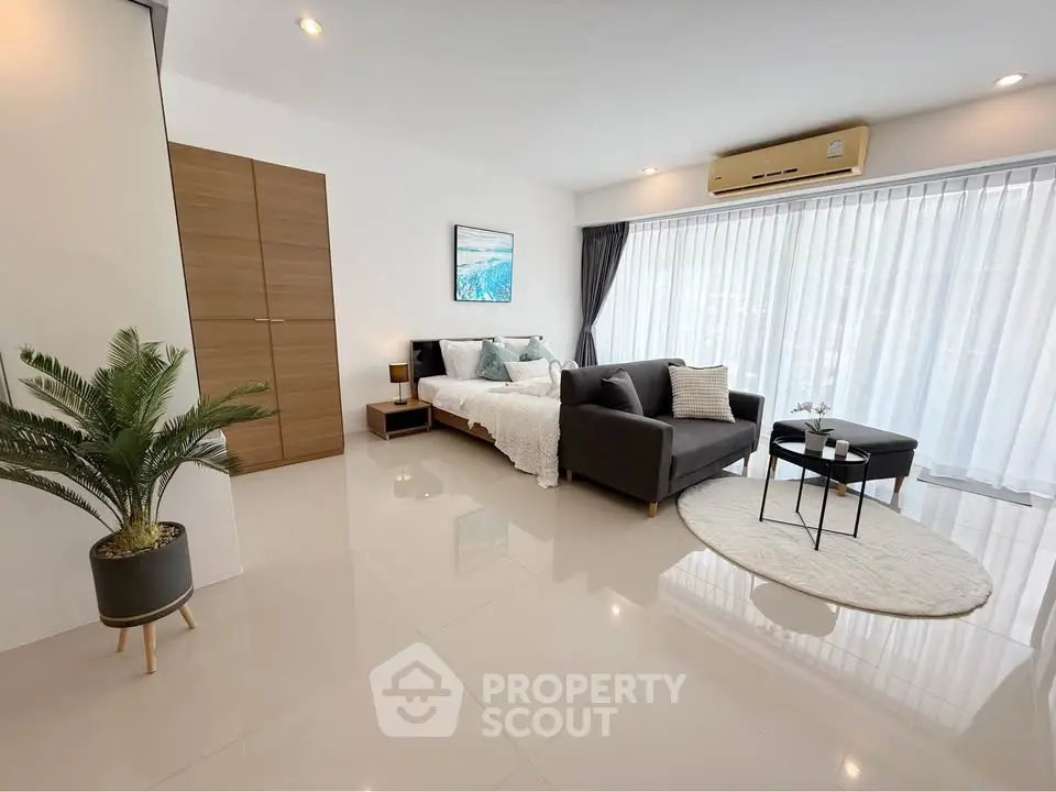 Modern studio apartment with sleek design and natural light