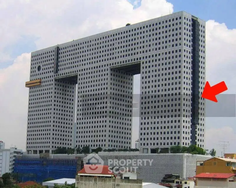 Unique architectural building with modern design and large central openings.