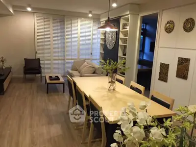 Spacious living room with modern decor and elegant dining area