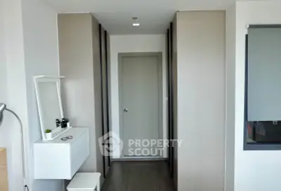 Modern minimalist hallway with sleek storage and neutral tones
