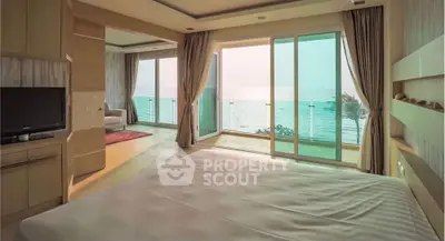 Luxurious bedroom with stunning ocean view and spacious balcony access.