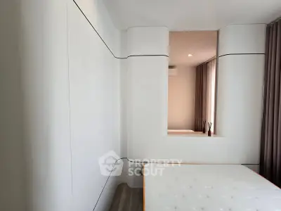 Modern minimalist bedroom with sleek design and neutral tones