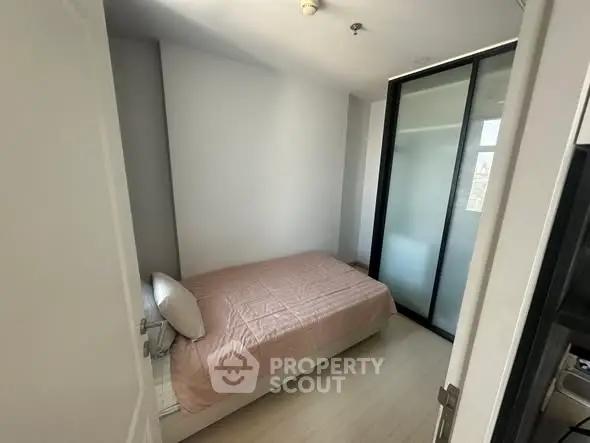 Cozy small bedroom with minimalist design and sliding door closet