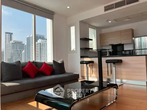 Modern living room with city view and sleek kitchen area