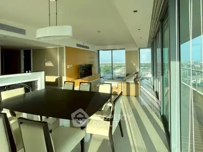 Luxurious modern living room with panoramic city views and elegant dining area.