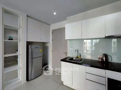 Modern kitchen with sleek cabinetry and stainless steel appliances