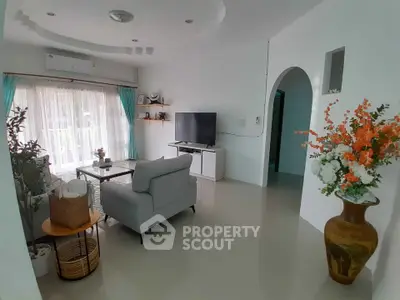 Bright and airy living room with modern decor and large windows