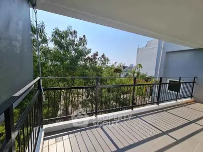 Spacious balcony with scenic view and modern railing design