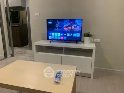 Modern living room with sleek TV setup and stylish furniture