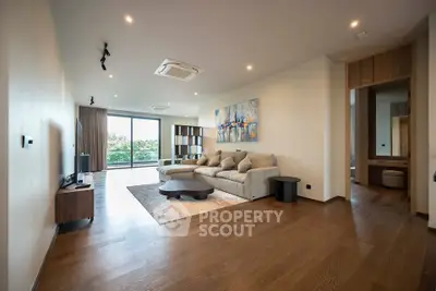Spacious modern living room with large windows and stylish decor