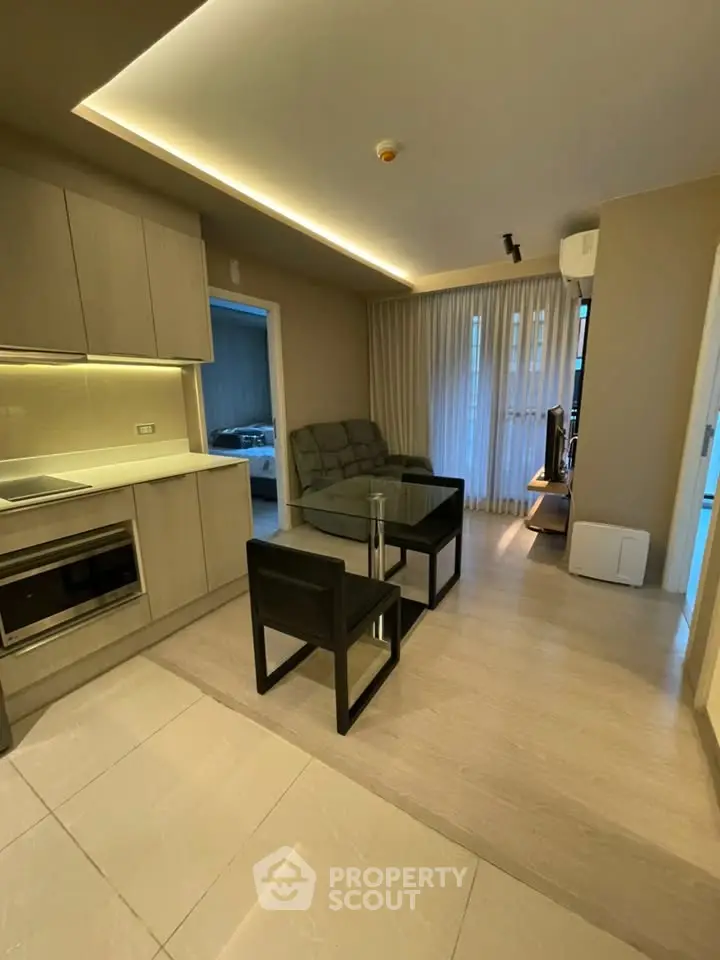 Modern living room with open kitchen and stylish furniture